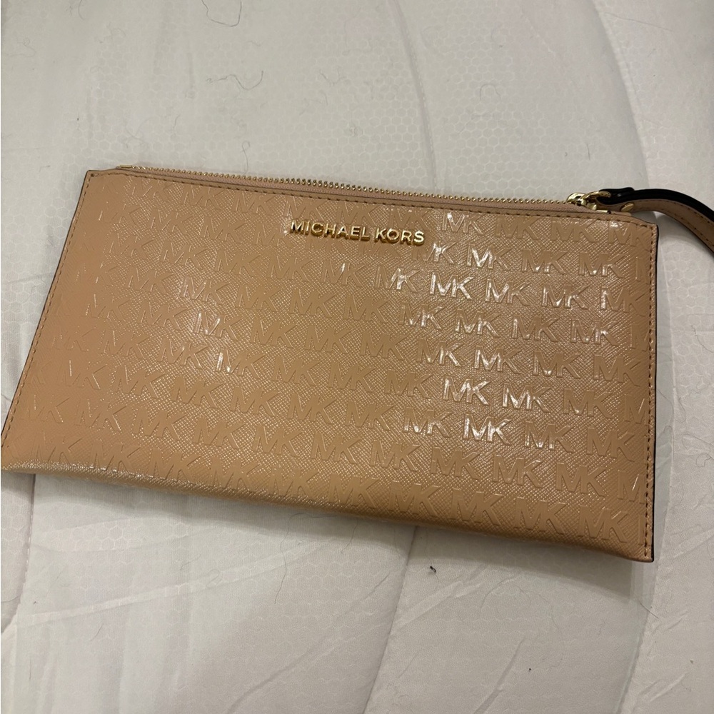 Michael Kors beige wristlet.